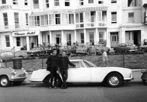 Proud owners of a new car. Brighton seafront 1960s.